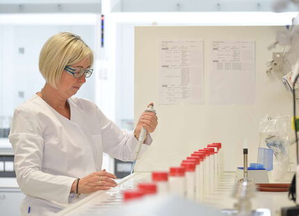 Laboratory technician Kathrin Cyron preparing drinking water samples for microbiological analysis of the total bacterial load